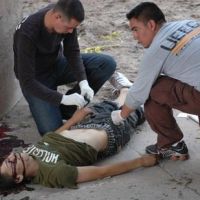 Mexican Forensic team examines the body of 15 year old Sergio Adrian Hernandez Güereca, murdered in cold blood by a cowardly US Border Patrol officer Jesus Mesa Jr. who sent multiple rounds across the Mexican/US border.